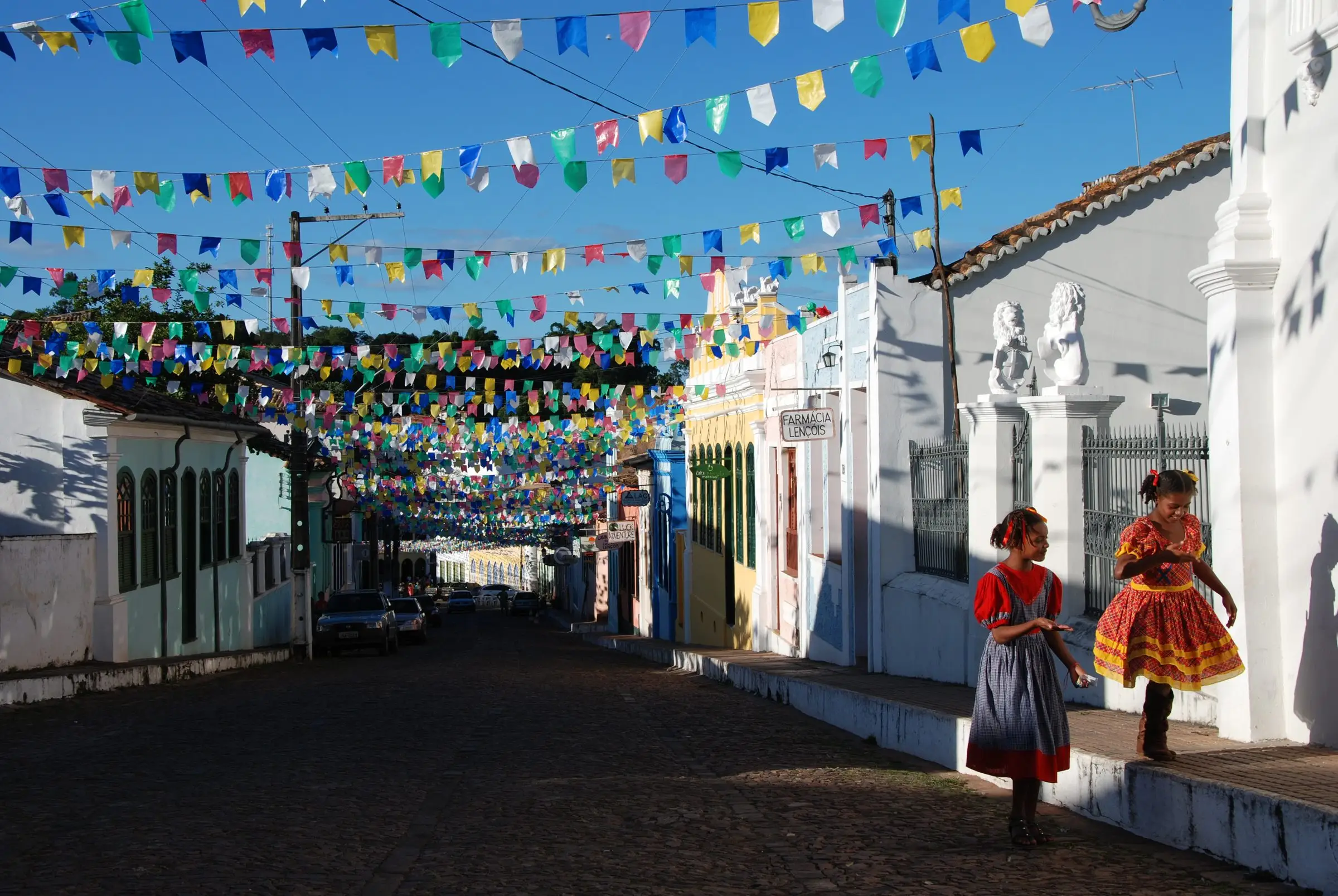 Cobbled street in the Lençóis historic centre decorated with festival bunting